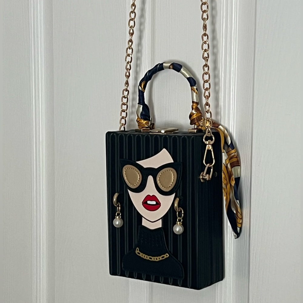 Vintage girl bag with dangly earrings, scarf handle, and gold chain